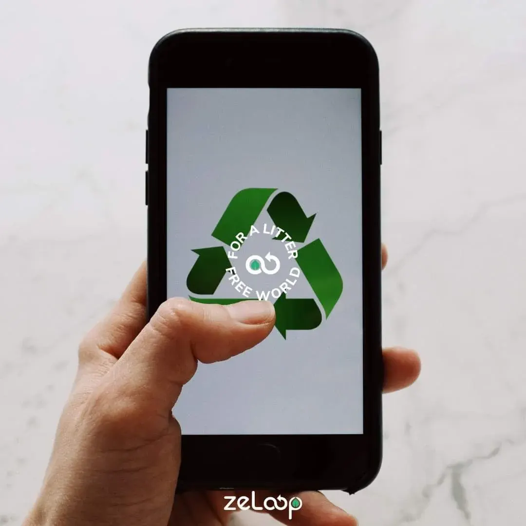 Person holding a smartphone with a recycling symbol for a school recycling challenge app